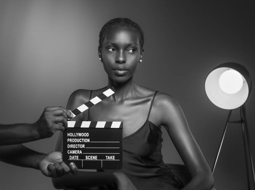 black white portrait woman with clapperboard old hollywood glamour style copy